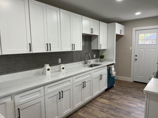 kitchen featuring a sink, white cabinetry, and dishwasher