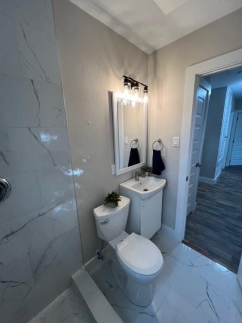 232 Alto Dr, Garland, TX 75040 - full bathroom featuring marble finish floor, a shower, vanity, and toilet