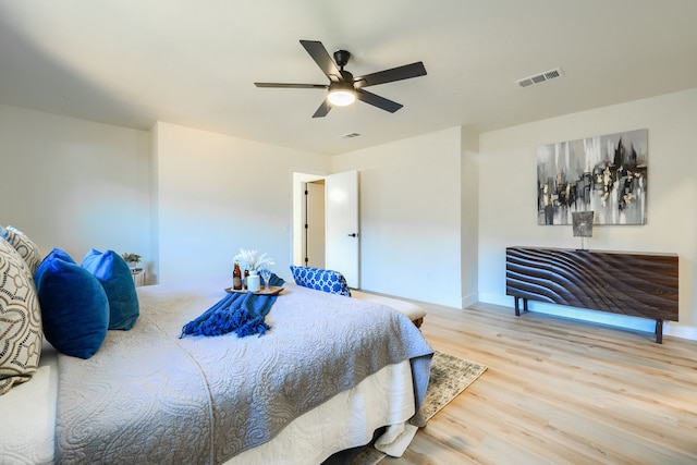 bedroom with hardwood / wood-style flooring and ceiling fan