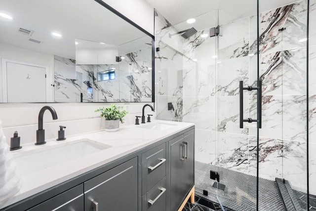 bathroom featuring vanity and an enclosed shower