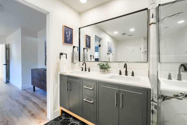 bathroom with hardwood / wood-style floors and vanity