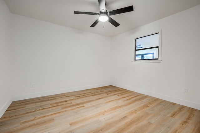 spare room with light hardwood / wood-style flooring and ceiling fan