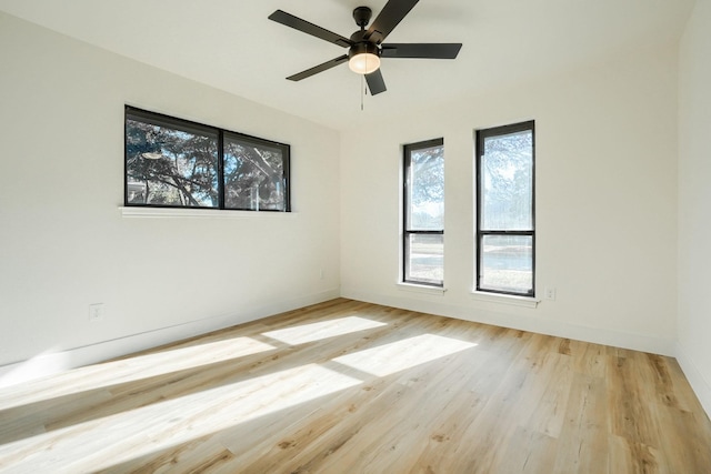 empty room featuring ceiling fan and light wood-type flooring