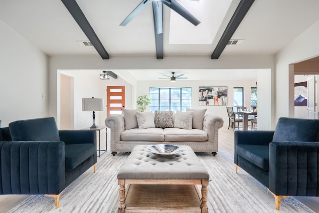 living room with ceiling fan, a healthy amount of sunlight, and light hardwood / wood-style floors