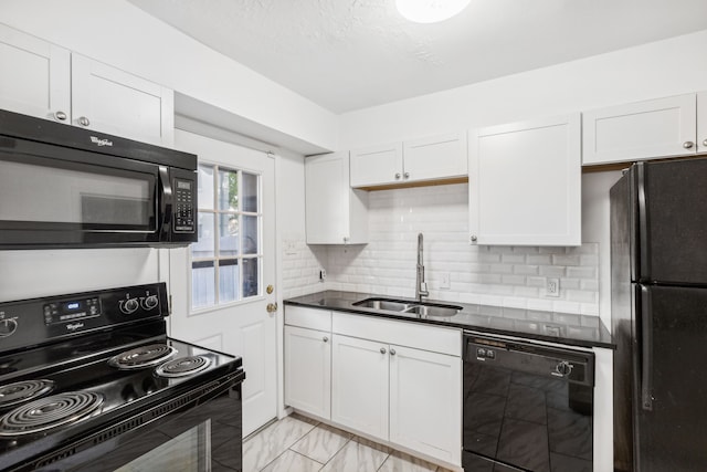 kitchen with backsplash, white cabinetry, sink, and black appliances