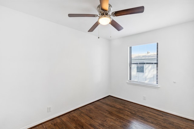 spare room featuring dark hardwood / wood-style floors and ceiling fan