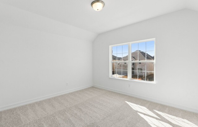 carpeted bedroom featuring an inviting chandelier and a raised ceiling