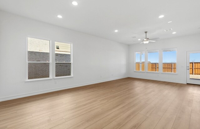 foyer with crown molding and light hardwood / wood-style floors