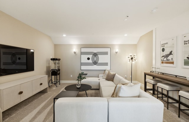 carpeted living room with lofted ceiling