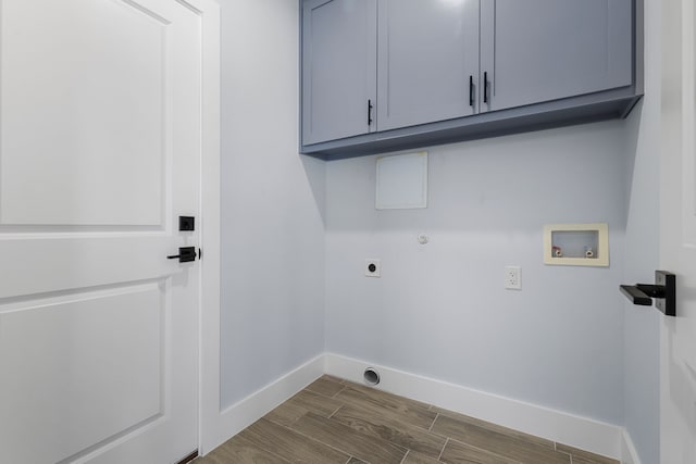 washroom featuring electric dryer hookup, cabinets, and washer hookup