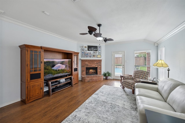 living room featuring ceiling fan, dark hardwood / wood-style flooring, and ornamental molding