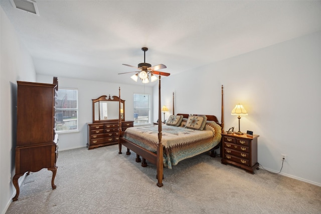 bedroom featuring ceiling fan and light carpet