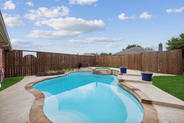 view of swimming pool featuring an in ground hot tub