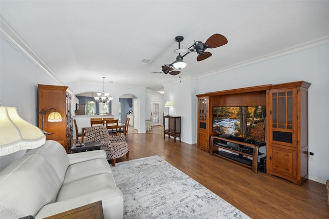 living room with crown molding, dark wood-type flooring, and ceiling fan with notable chandelier