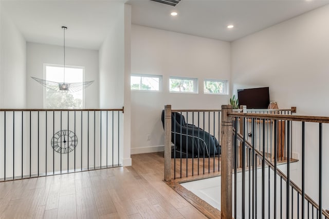 interior space with light hardwood / wood-style flooring and a notable chandelier