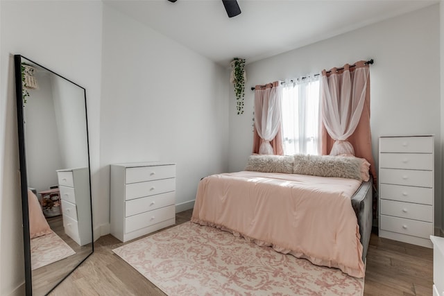 bedroom featuring ceiling fan and light hardwood / wood-style floors