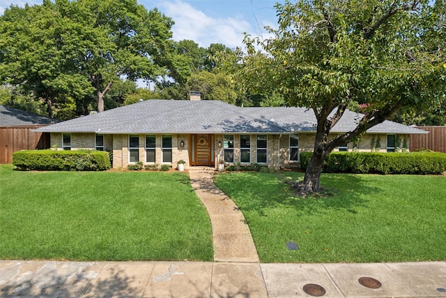 ranch-style house with a front yard