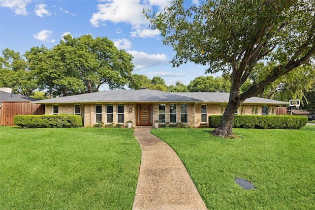 ranch-style house with a front lawn