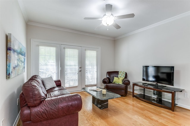 living room with crown molding, french doors, and wood-type flooring