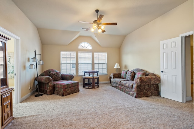 carpeted living room featuring ceiling fan and vaulted ceiling