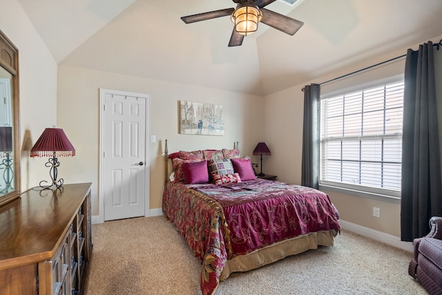 bedroom featuring ceiling fan, light colored carpet, and lofted ceiling