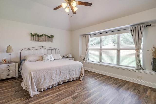 bedroom featuring ceiling fan, lofted ceiling, and dark wood-type flooring