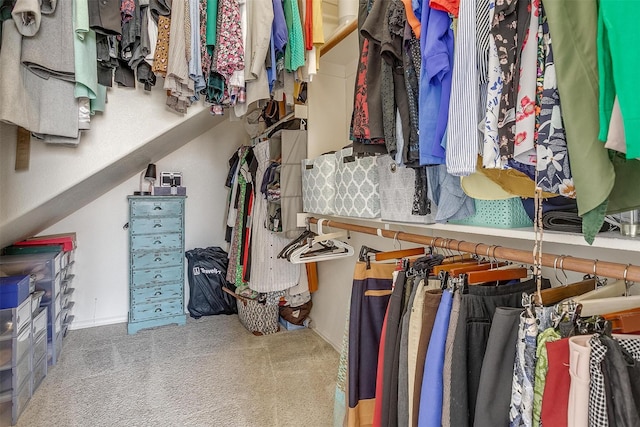 walk in closet featuring carpet floors