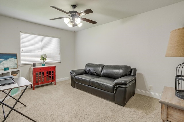 living room featuring carpet floors and ceiling fan