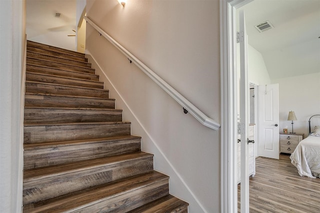 stairway featuring hardwood / wood-style floors