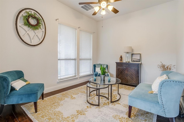 sitting room featuring ceiling fan and wood-type flooring