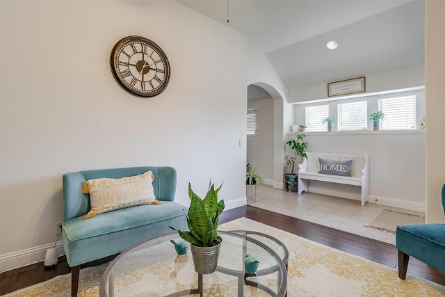 sitting room featuring light hardwood / wood-style floors and vaulted ceiling