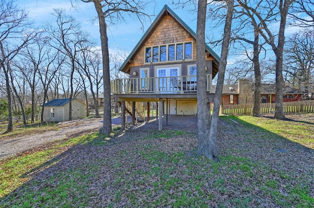 view of front of house featuring an outdoor structure and a deck