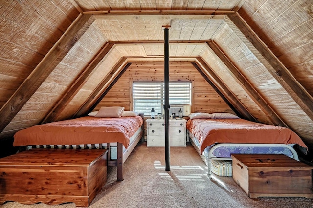 unfurnished bedroom featuring carpet flooring, wood ceiling, and vaulted ceiling