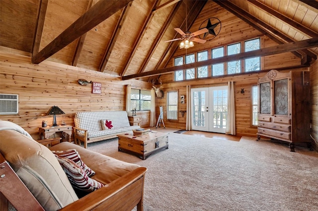 living room featuring french doors, wood walls, a wall mounted air conditioner, wooden ceiling, and beam ceiling