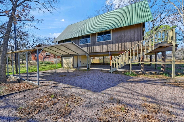 back of property featuring a carport