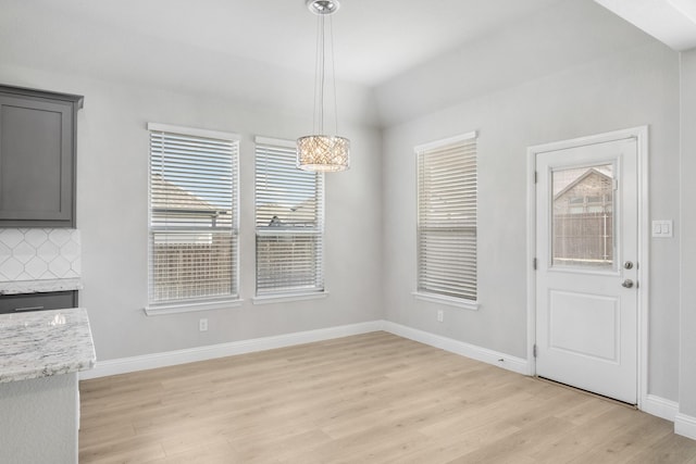 unfurnished dining area with light hardwood / wood-style floors