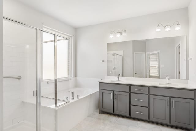 bathroom featuring vanity and plus walk in shower