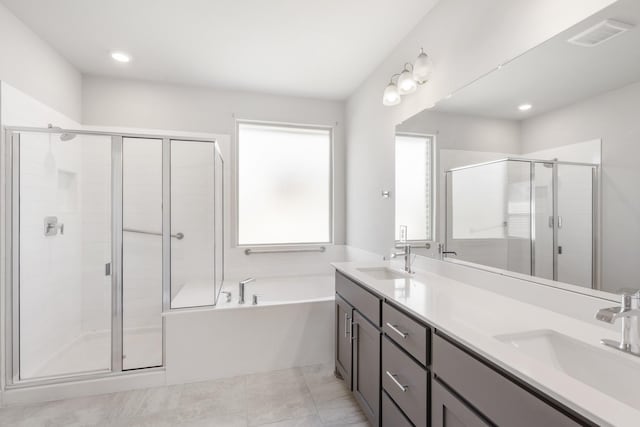 bathroom featuring vanity, tile patterned floors, and independent shower and bath