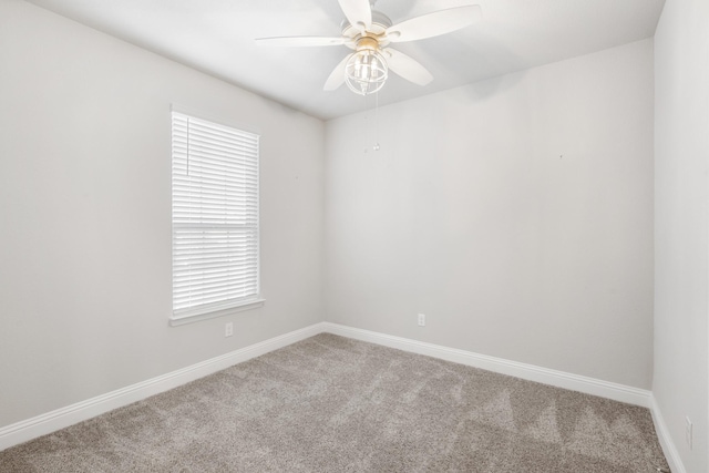 carpeted empty room featuring ceiling fan