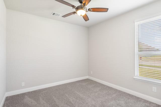 carpeted empty room featuring ceiling fan