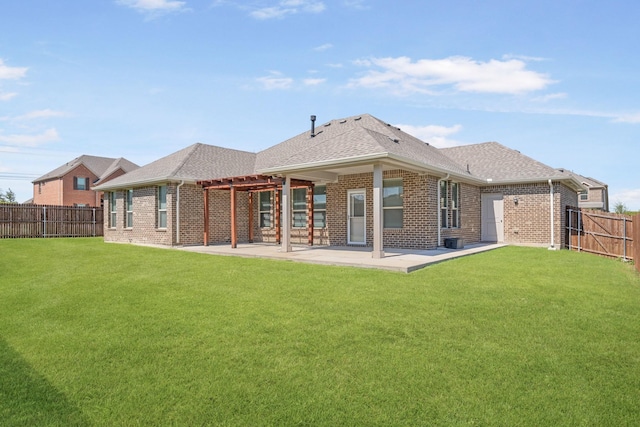 back of house with a lawn, a pergola, and a patio