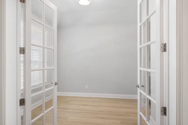 interior space featuring light wood-type flooring and french doors