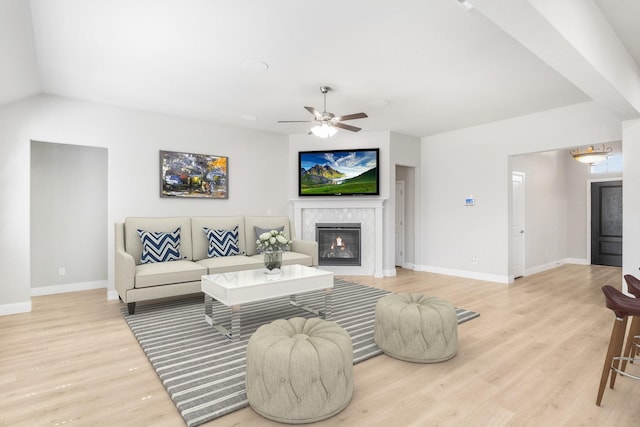 living room with light wood-type flooring and ceiling fan