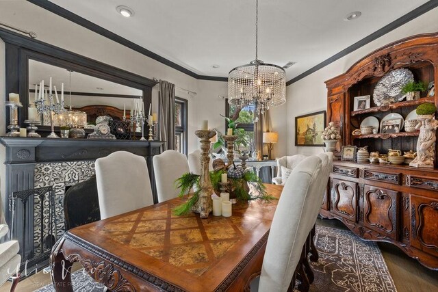 dining area with a chandelier, wood-type flooring, and ornamental molding