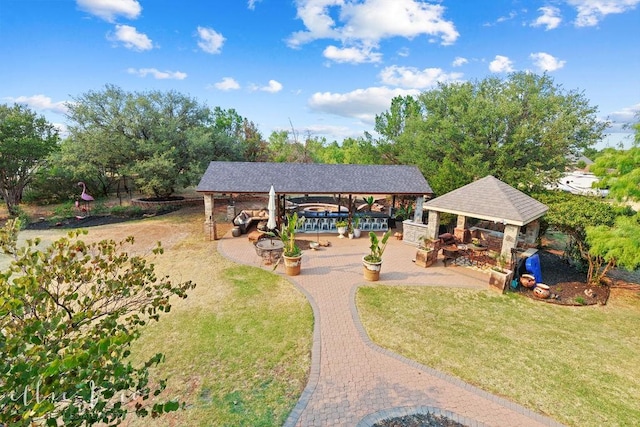 view of property's community with a gazebo and a lawn