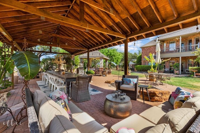 view of patio with outdoor lounge area and a bar