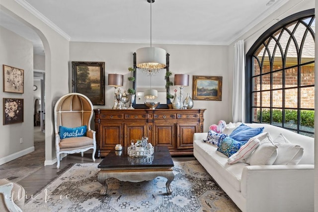 sitting room with dark hardwood / wood-style floors and crown molding