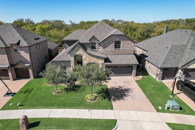 french country inspired facade featuring a front lawn