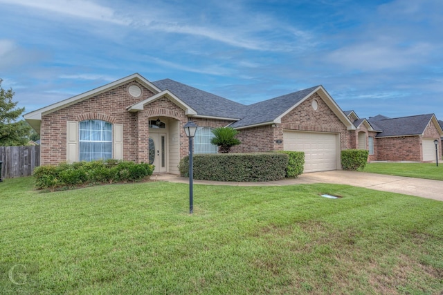 single story home with a front lawn and a garage