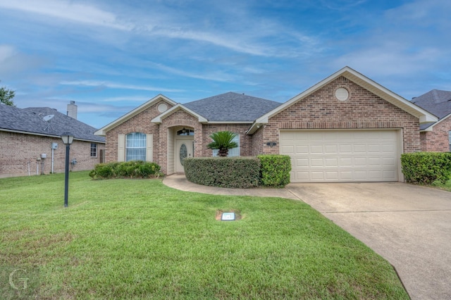 view of front facade featuring a garage and a front lawn